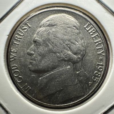 1985 Jefferson nickel die clash error showing ghost impression of opposing design transferred into the coin fields